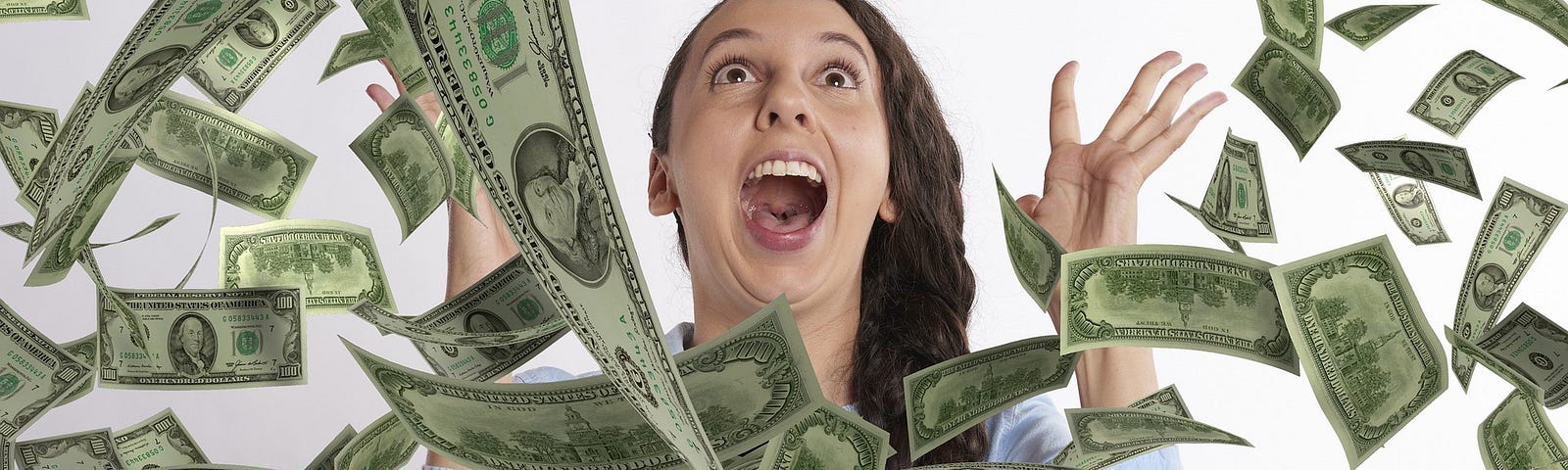 Image of excited woman yelling excitedly as money falls out of the sky