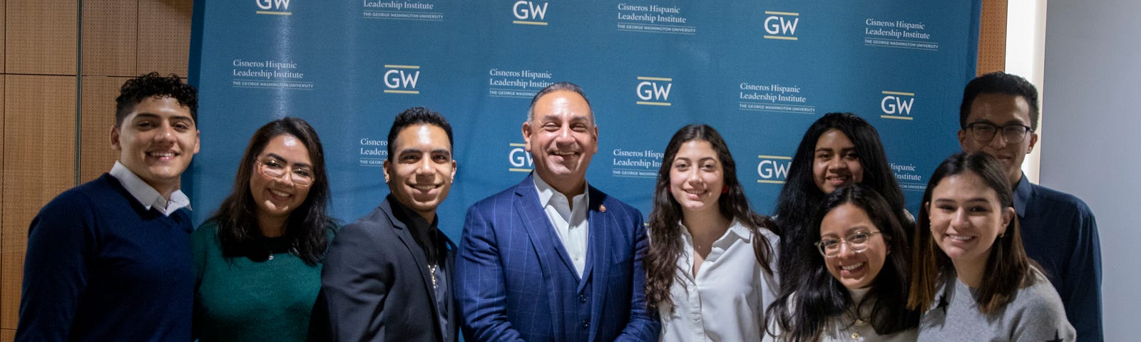 Congressman Gil Cisneros stands with Scholars from the Cisneros Hispanic Leadership Institute