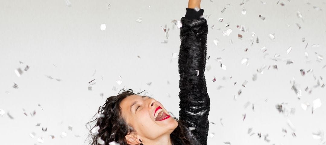 Woman celebrating with glitter