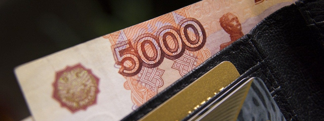 IMAGE: A five thousands rubles bill and a few credit cards inside a wallet