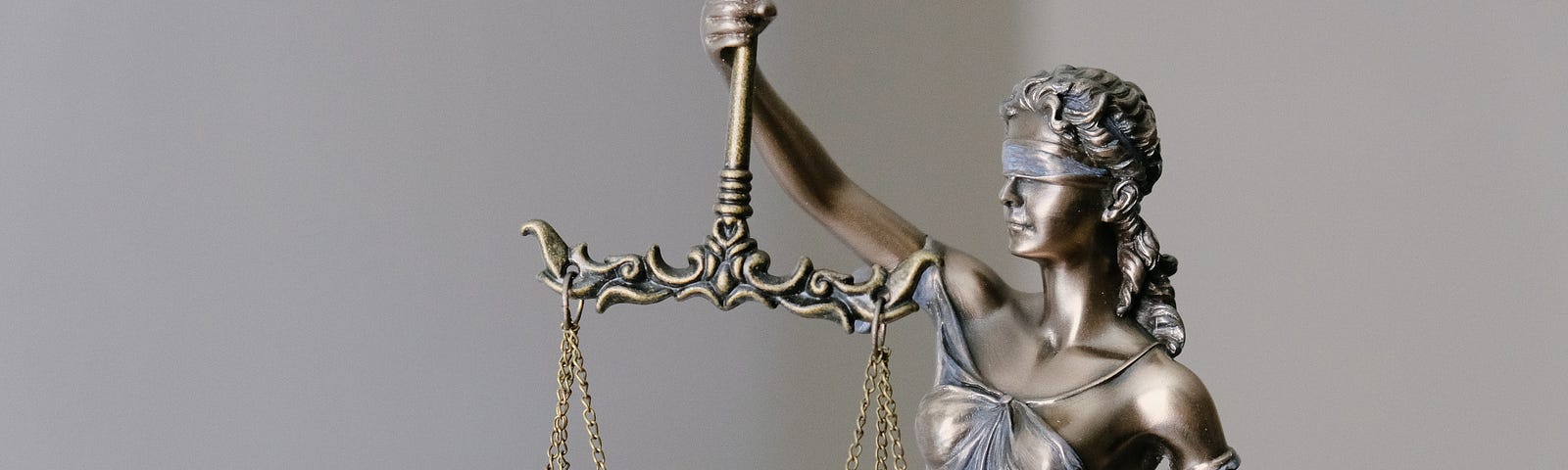 photo of a small scales of justice statue