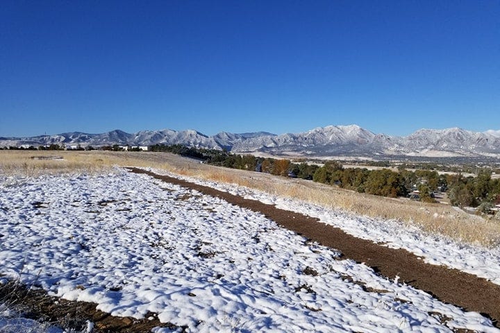 An unseasonably early dusting of snow on the Colorado mountains
