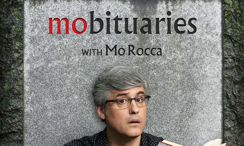 Graphic with a man with glasses and gray hair reading a book in front of a gravestone.