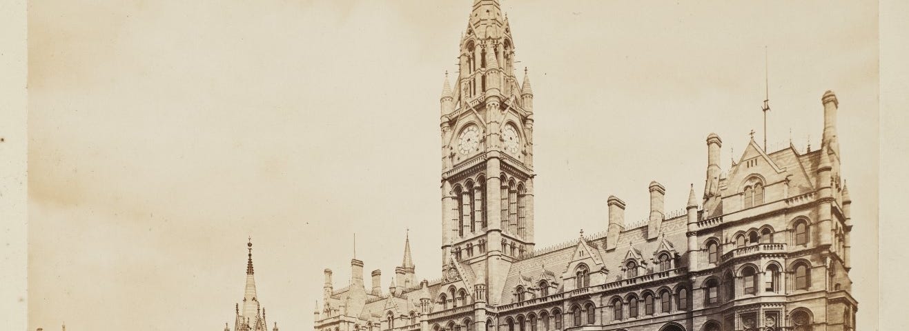 Exterior of Manchester’s neo-gothic Town Hall in Albert Square, with the Albert Memorial and a row of horse-drawn cabs (1877)