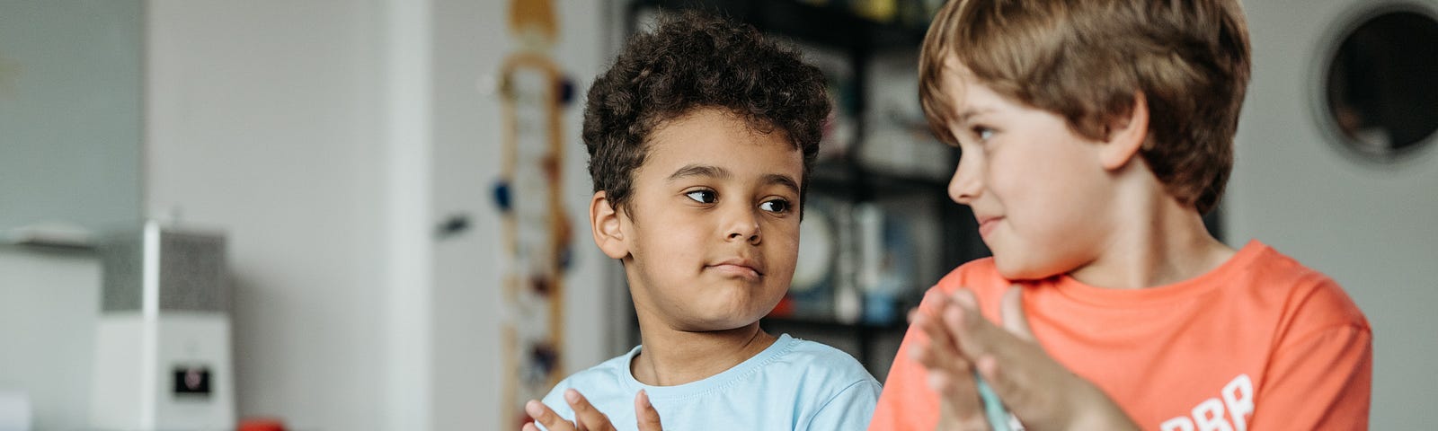 beautiful brown skinned boy with friend playing