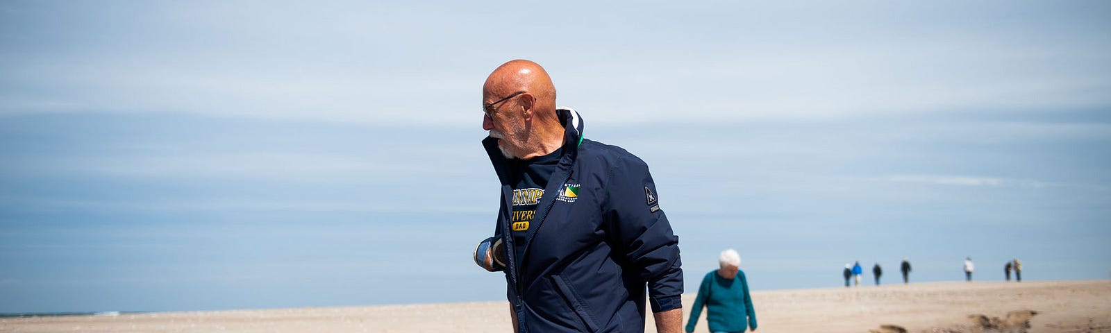 Dad leads mom on their beach walk near Baakdeel. Rantum, Germany, May 24, 2019.