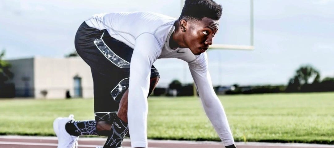 Man getting ready to run; setting new year resolution and achieving it