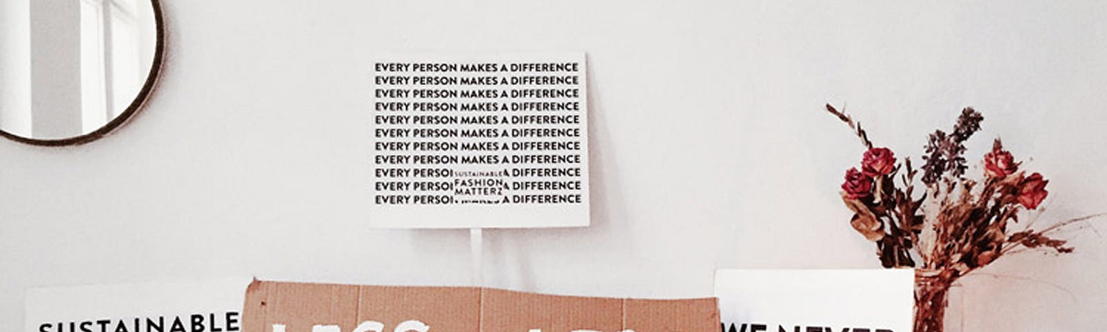 sustainability posters in a white bedroom