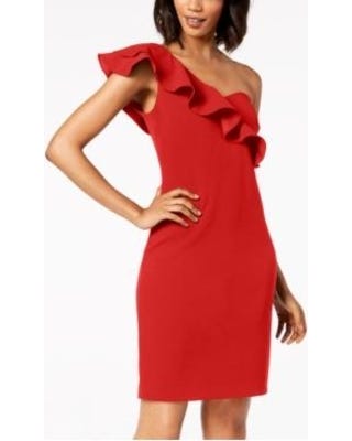 Picture of a red cocktail dress with one shoulder covered in ruffles and the other shoulder completely bare. It’s fabulous.