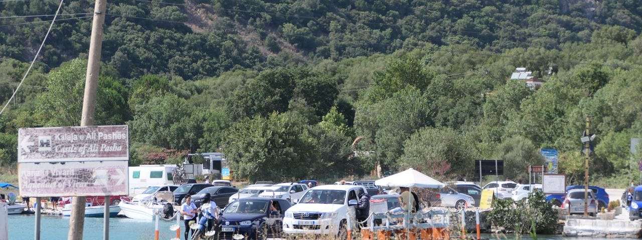 A makeshift ferry full of cars in Albania.