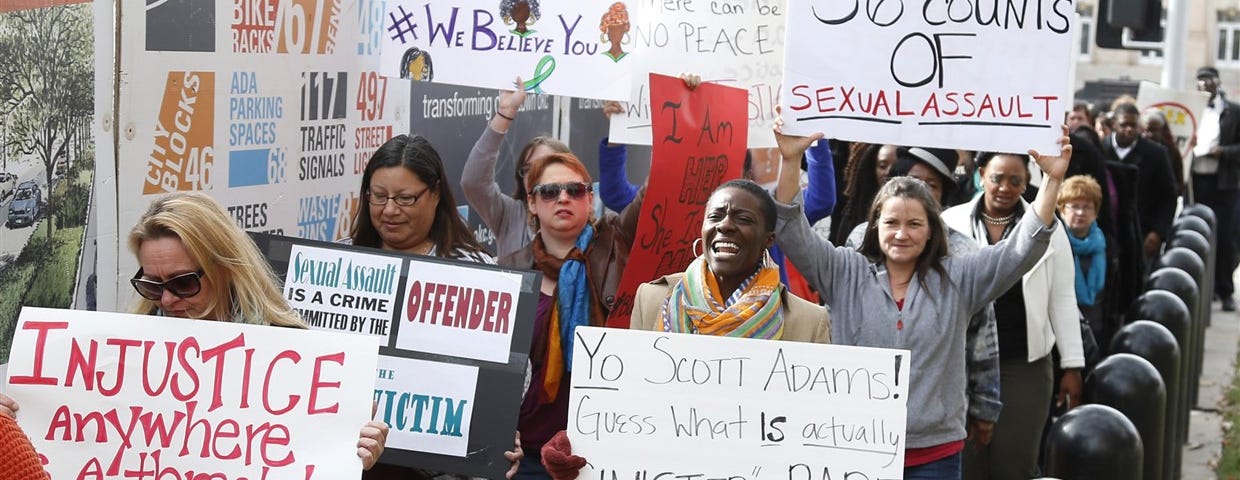 A large group of protestors carry signs outside the courthouse as the jury deliberates in the trial of Daniel Holtzclaw, in Oklahoma City on Dec. 8, 2015. Signs read: “Injustice anywhere is a threat to justice everywhere”, “Yo Acott Adams! Guess what is actually sinister rape”, “36 counts of sexual assault”, “#blackwomenmatter #webelieveyou”