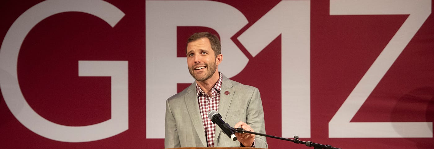 A picture of President Seth Bodnar before the Griz R1 sign.