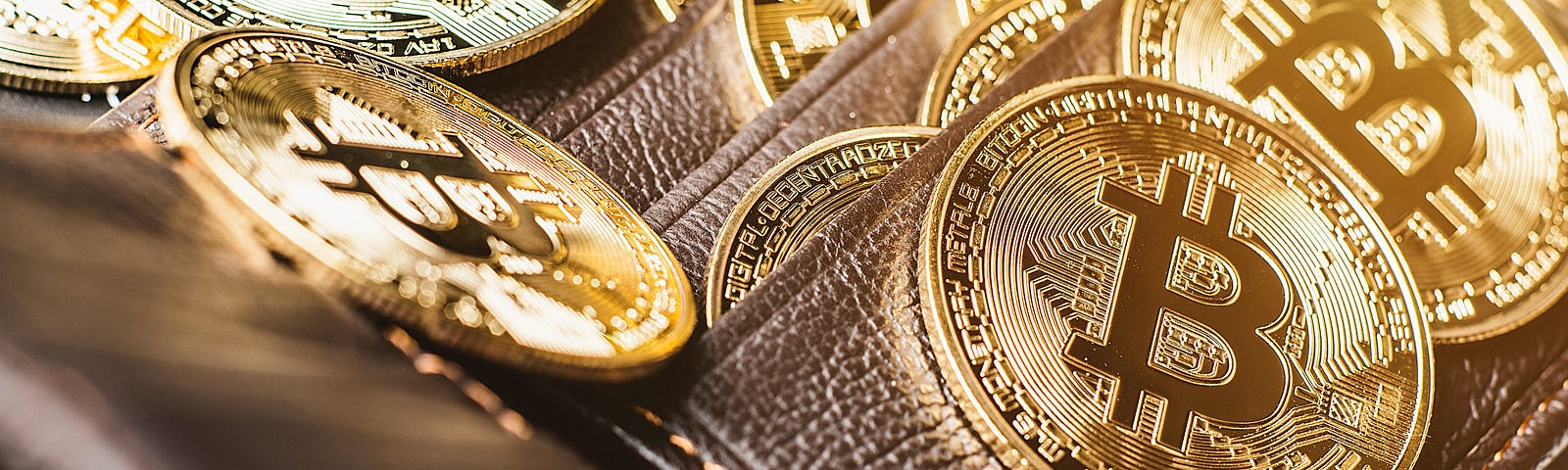 Bitcoins in a wallet, from Shutterstock.