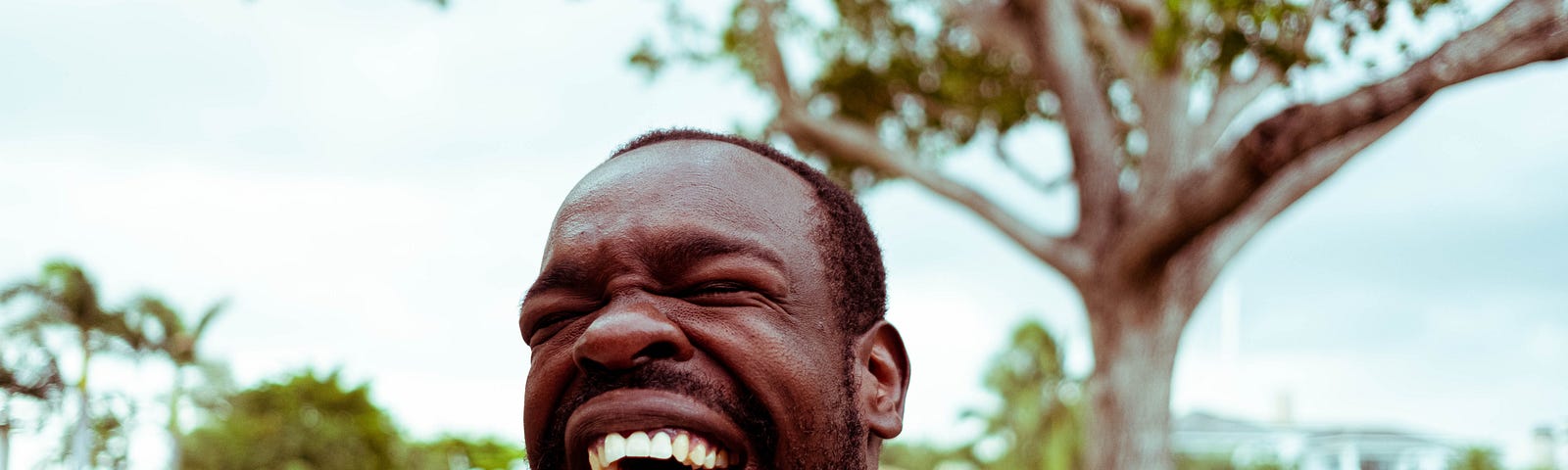 A Black man laughing.