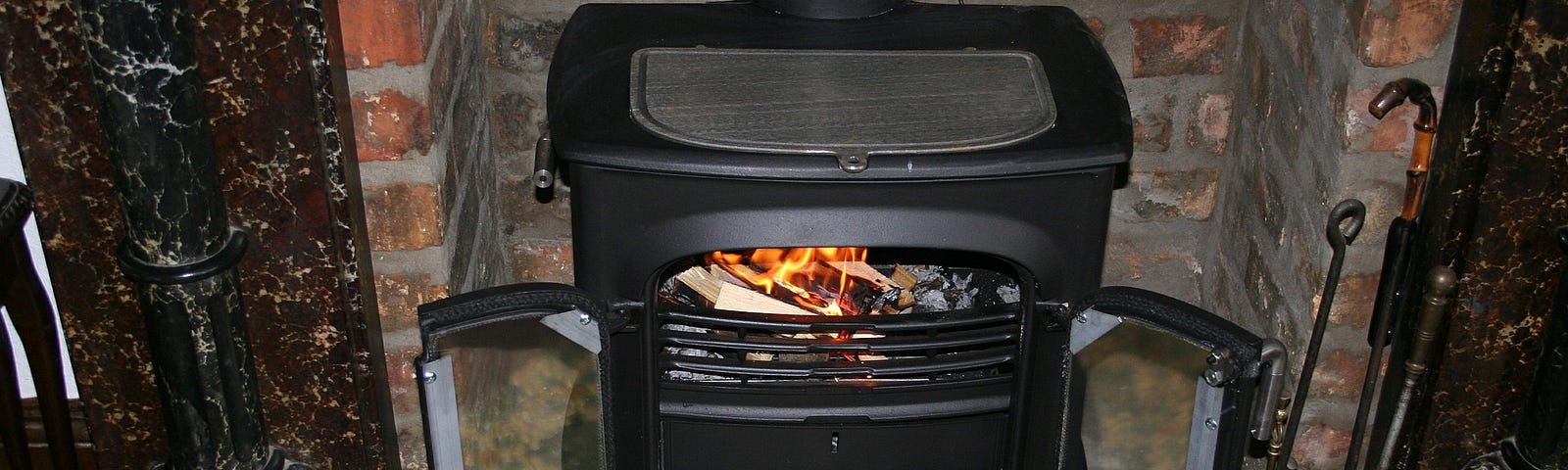 Wood burning stove with fire.