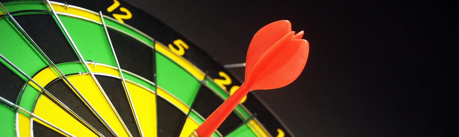 Red and Brass Dart Pin on Dartboard