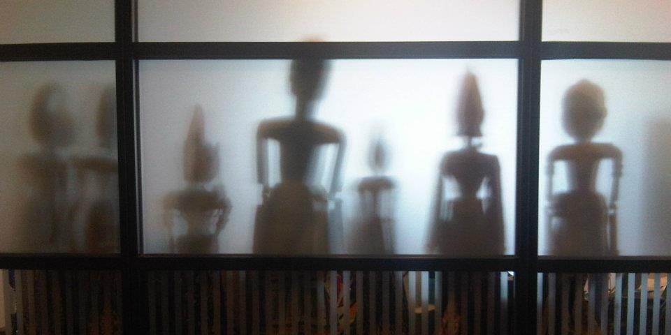 Shadowy human figures approaching