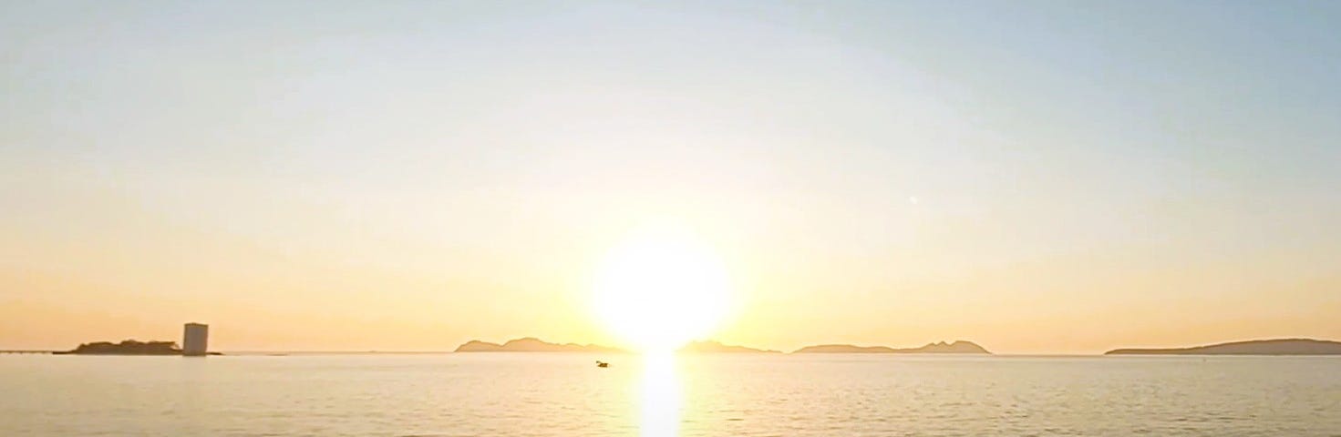 A view of Samil Beach in Vigo during sunset.