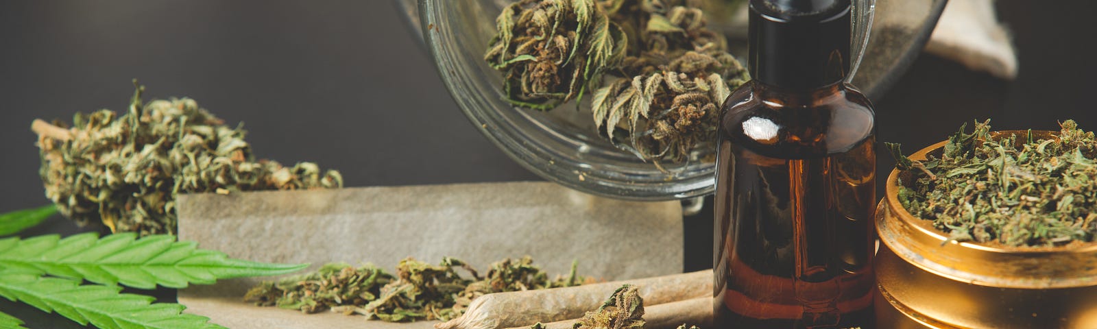 various forms of marijuana, including loose, joints, and buds in a jar