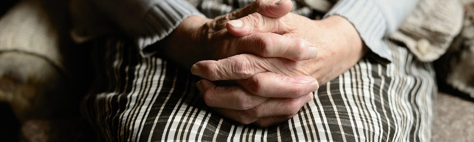 Elderly woman praying