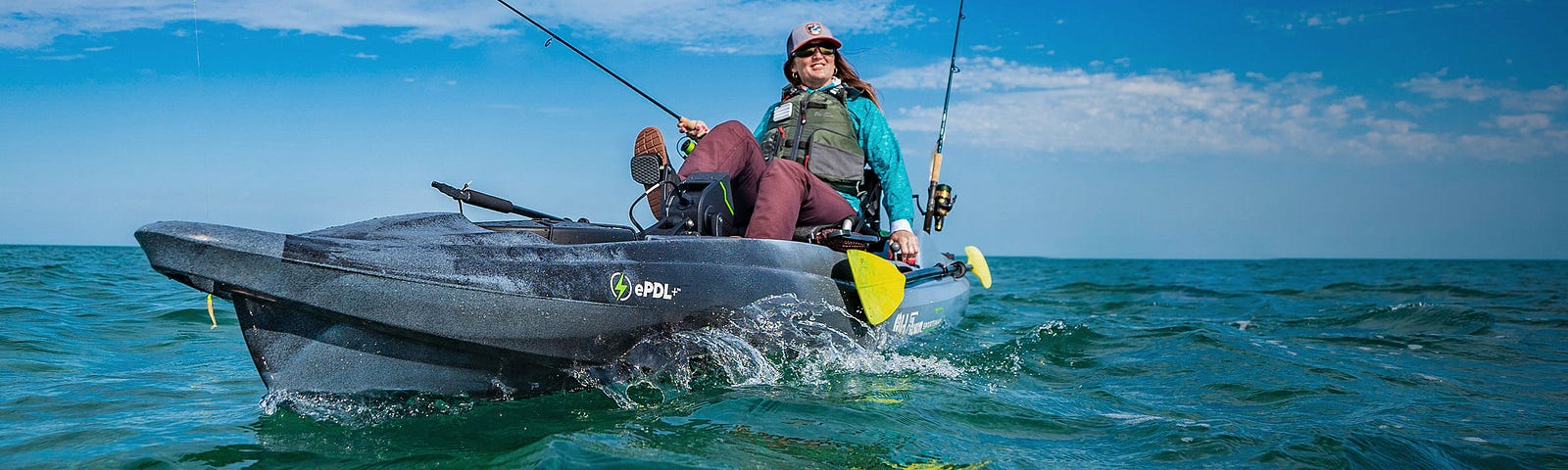 A woman angler pedaling to her next water hole in the ePDL+132 electric pedal assist kayak.
