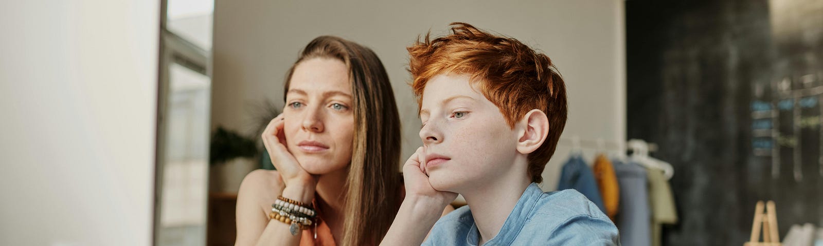 Woman and child staring at computer