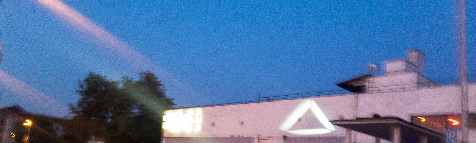 Running scenes that say “I Just want to have fun” — Scenes from early Sunday morning Prague: A group of partygoers stands in front of a night club, a man sleeps on a small wall. Prague, Czechia, September 15, 2019.