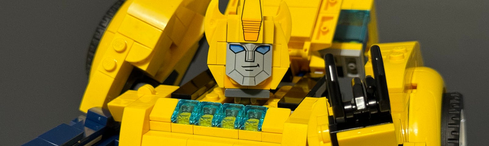 Bumblebee showing the rock on sign with his fingers.