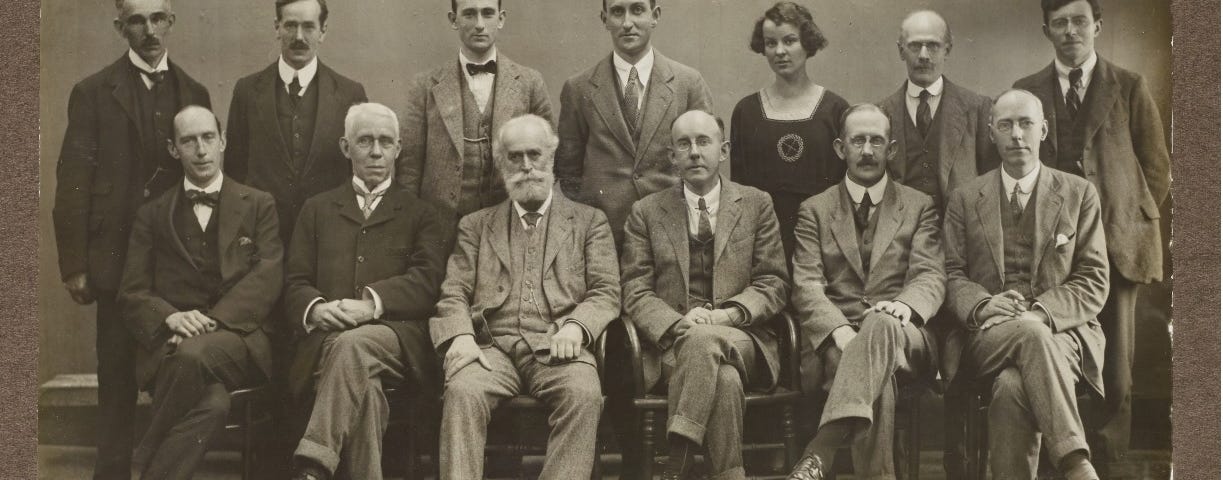 photograph of male employees at the Guardian. Madeline, the only woman, is on the back row