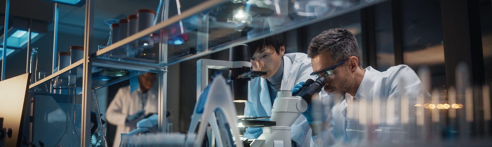 Scientists in a biotech lab. Photo by Gorodenkoff/Adobe Stock