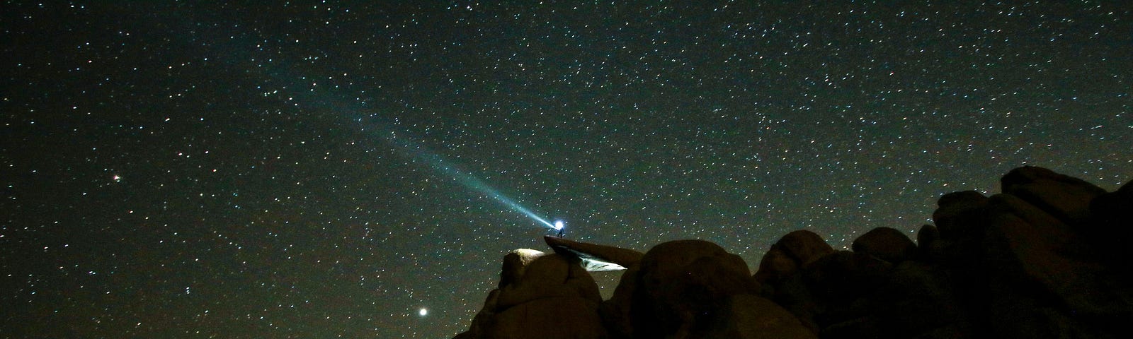 Starry night over rock formation