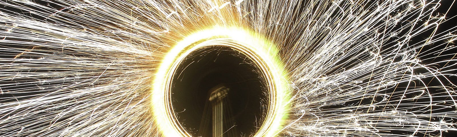 Image of a Catherine wheel firework alight spinning and sparks flying in Holland