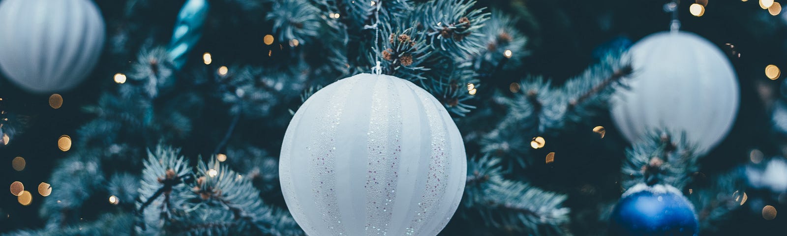 Photo of a Christmas Tree with white and blue baubles