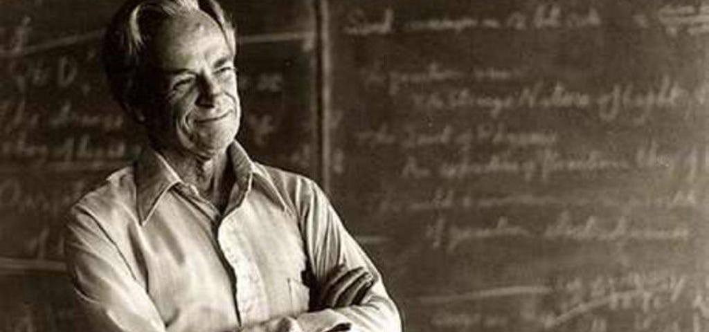 Richard Feynman in front of a blackboard