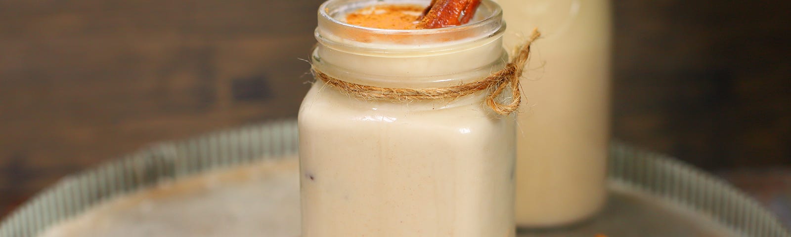 Easy, homemade, refreshing dairy-free horchata in a glass with cinnamon and rice