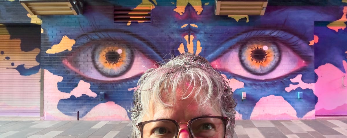 Author in Dairy Block, Denver, Napolitano Art mural