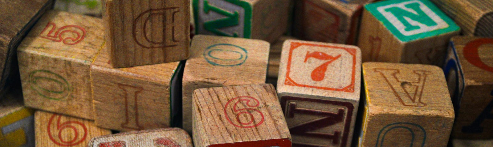 Used wooden blocks for kids with letters and numbers.