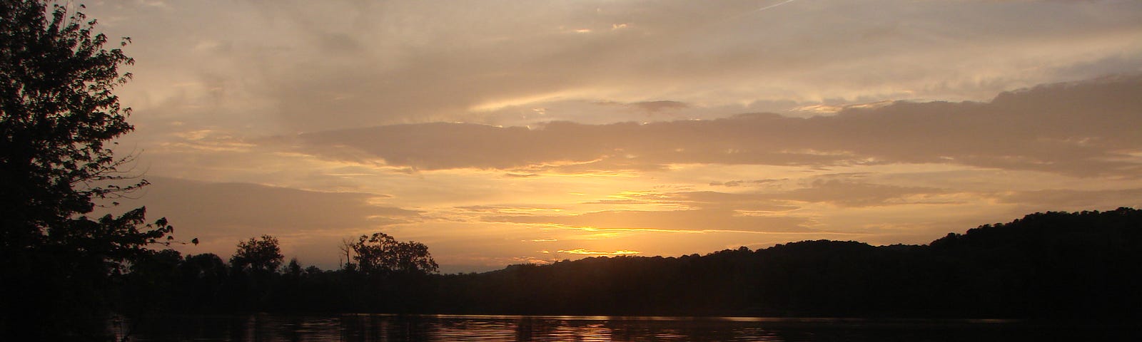 sun setting on a river. (River parable)