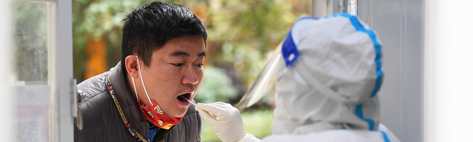 A man takes a COVID test at a nucleic acid testing site in Guiyang, Guizhou province, China, December 8, 2022. Photo by Costfoto/Sipa USA/Reuters