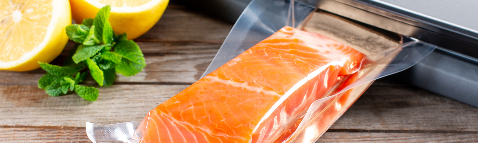 A salmon fillet shrink wrapped in plastic