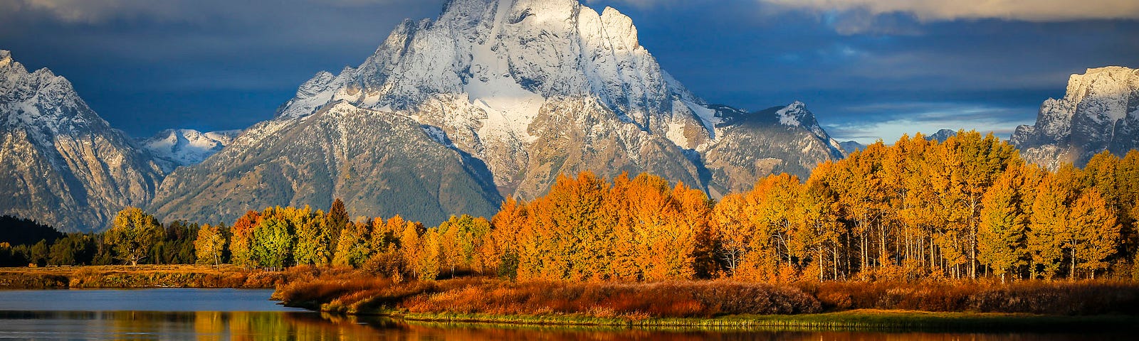 A beautiful mountain in Idaho on the river as the sun is setting.