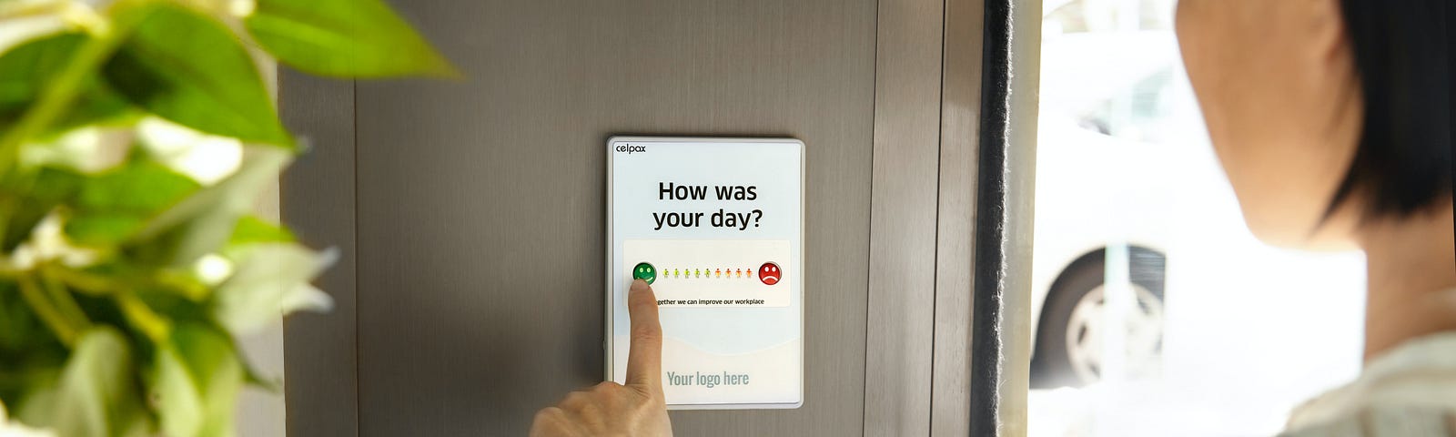 A woman rating her day on a mobile device