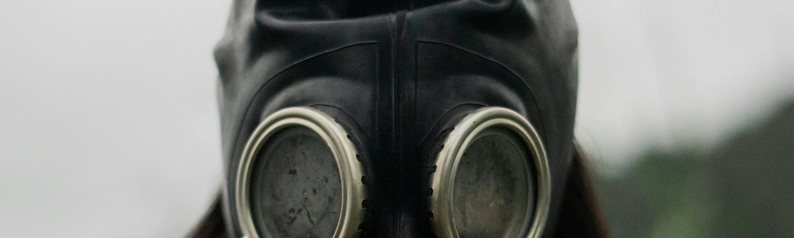 A lady in an old-fashioned gas mask