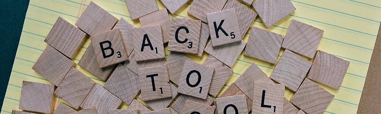Scrabble letters spelling out “back to school”.