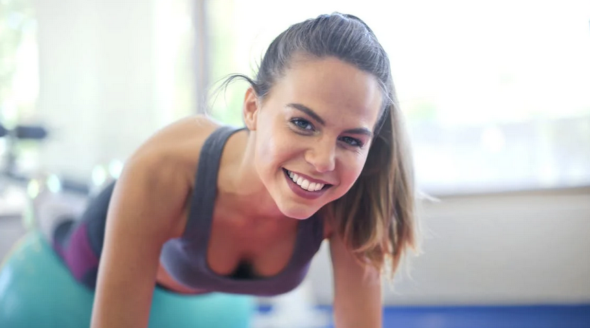woman exercising and smiling