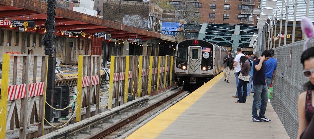 New York City F train approaches platform.