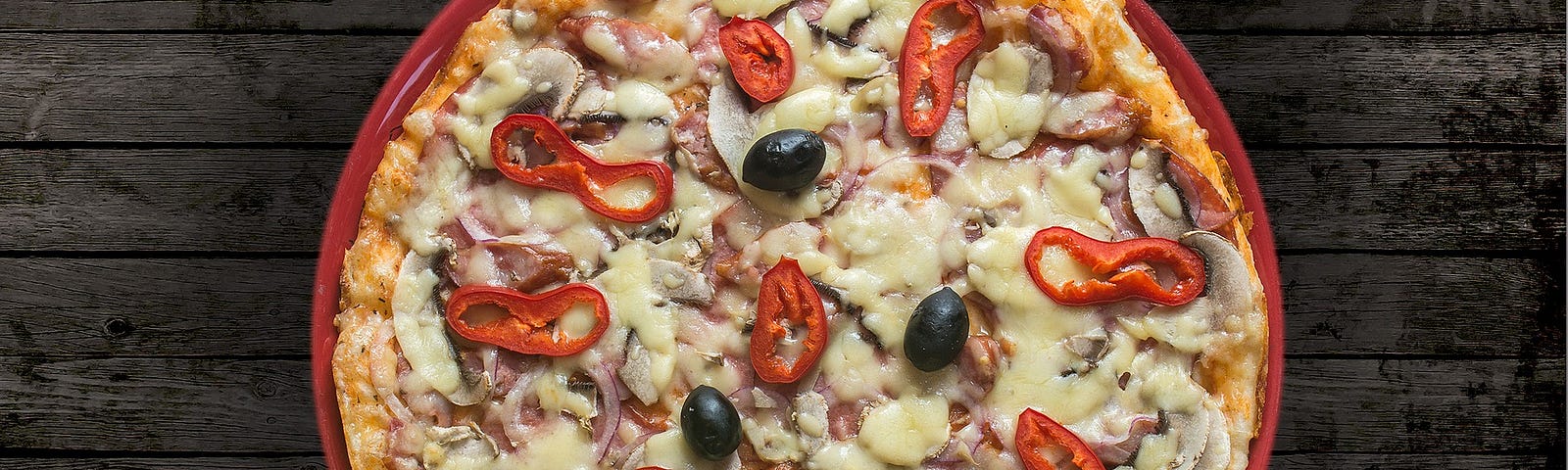 a pizza with peppers and olives
