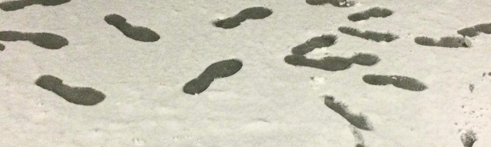 Footprints and family name: Mehta’s on a sheet of snow.