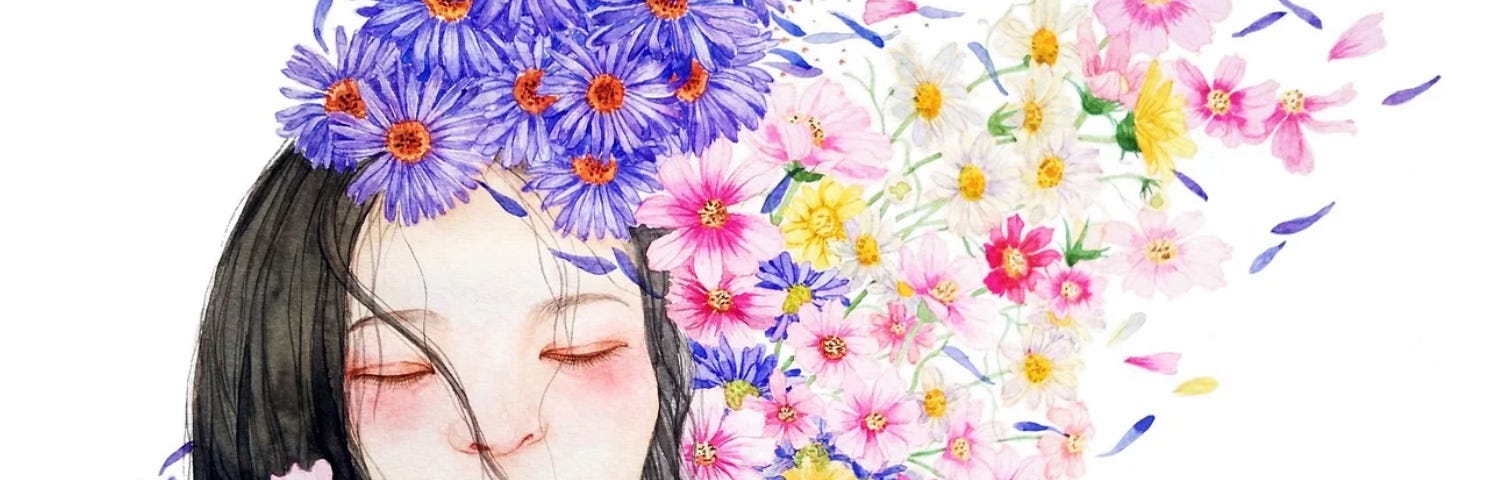 A girl’s face surrounded by beautiful flowers.