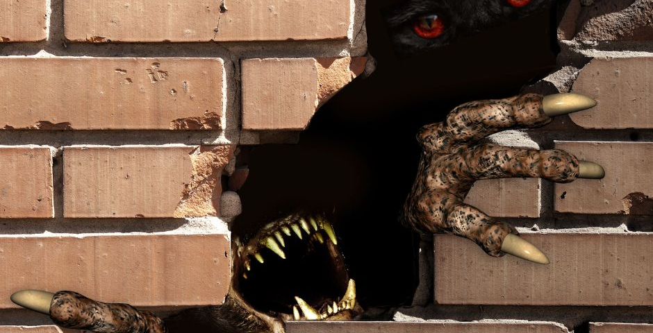 a monster with long claws and big teeth breaks through a brick wall. Red eyes are seen in the distance.